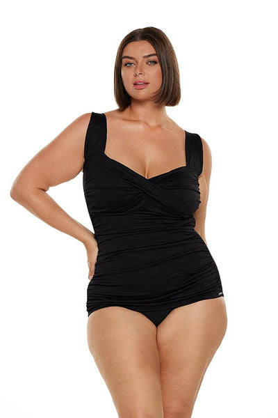 brunette model wears flattering retro inspired one piece in black