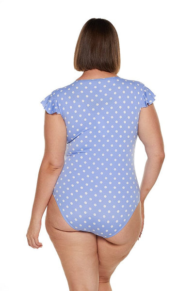 brunette women wears chlorine resistant retro one piece in blue polkadot