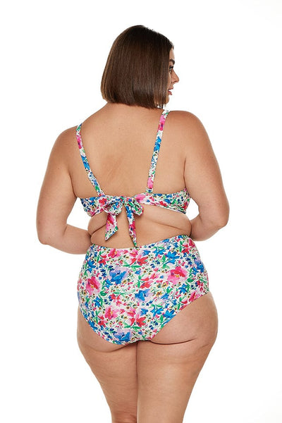 Back of model wearing flattering high waisted swim pant in bright colours for curvy women