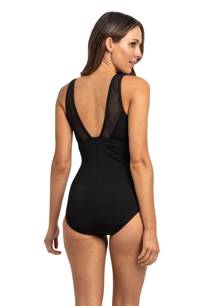 back of model wearing swimsuit in black with v back 