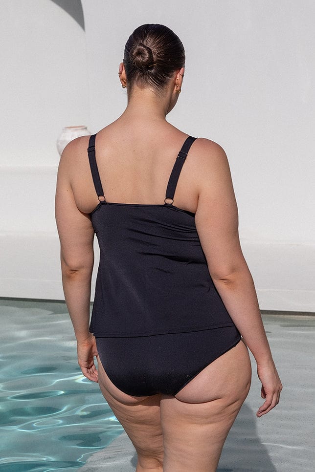 brunette women wearing ladies black pool proof tankini top with adjustable straps