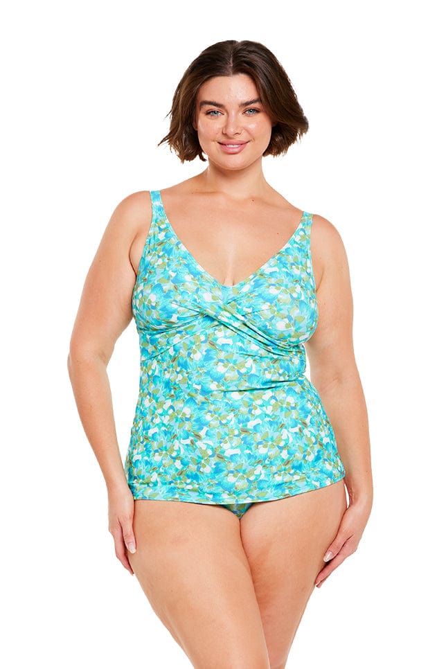 Brunette plus size women wears blue cross over v neck tankini top