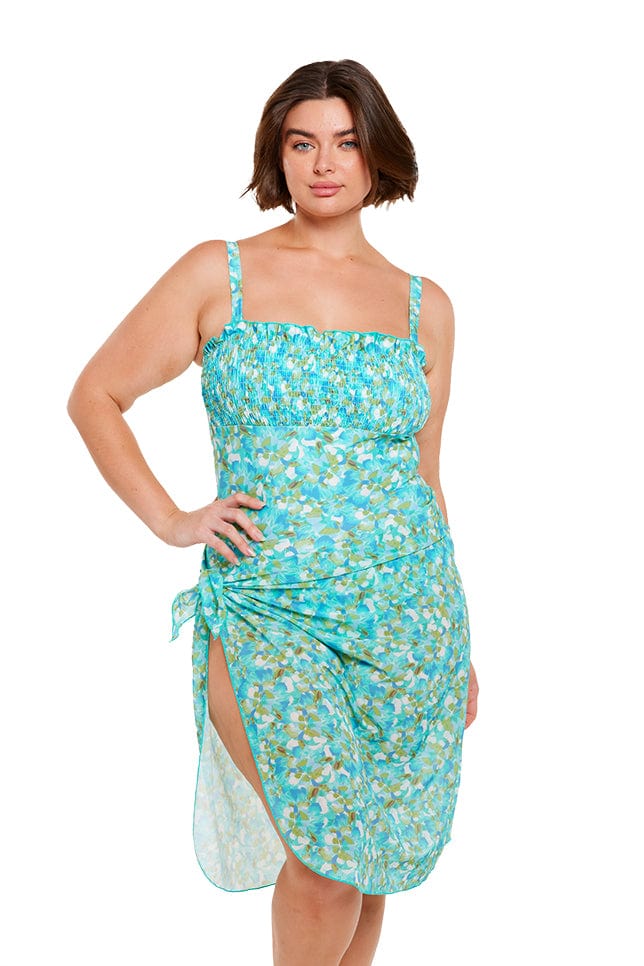 Brunette plus size model wears turquoise blue long mesh wrap beach sarong