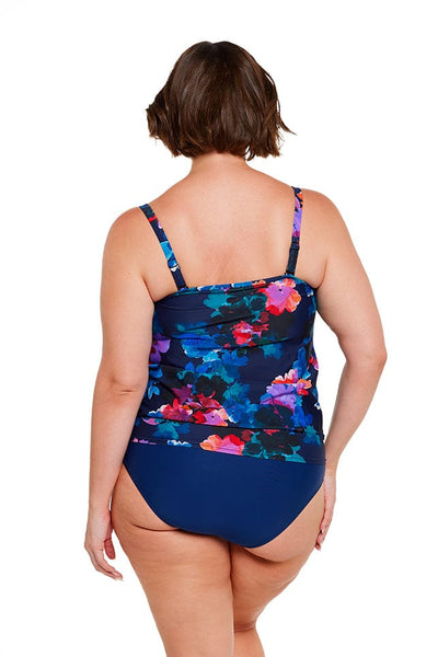 brunette women wears flouncy strapless bandeau tankini top navy blue