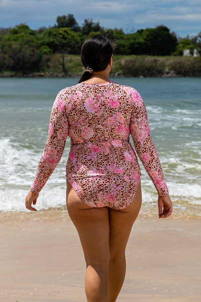 Model wearing plus size long sleeve rash vest in animal print