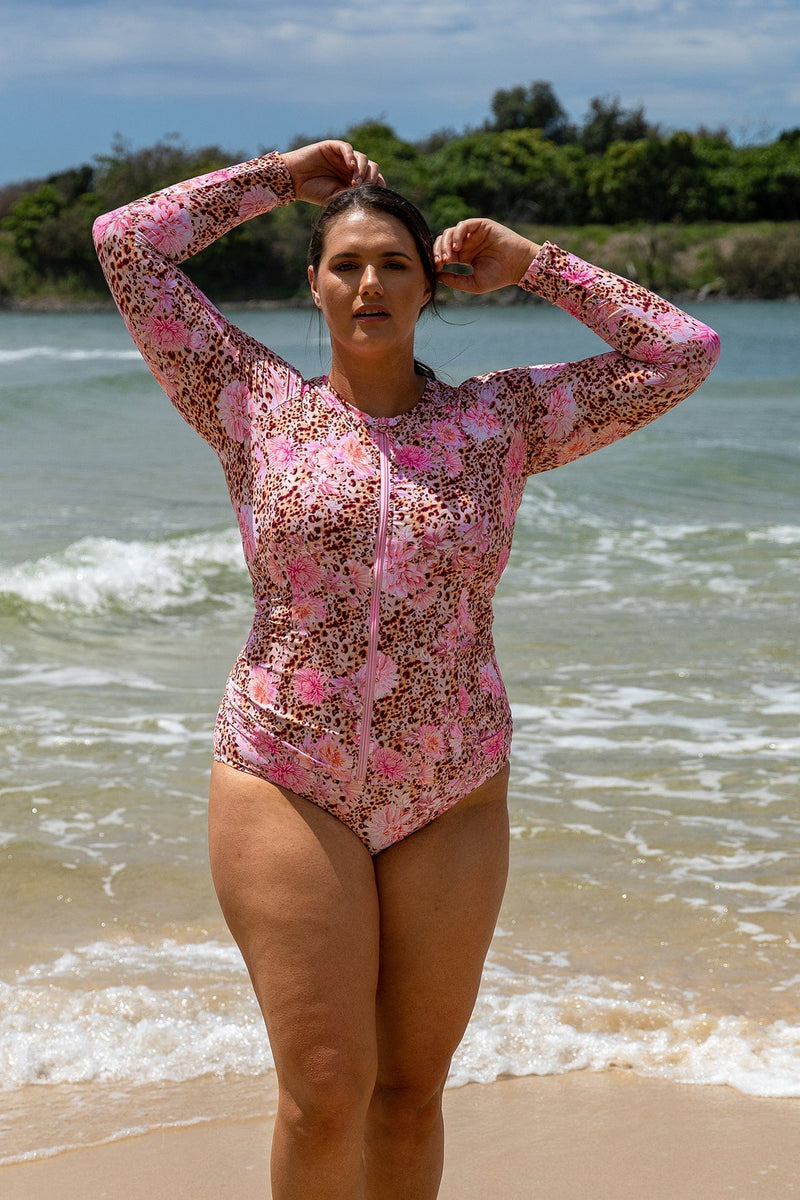 Plus size woman wearing long sleeve leopard rash vest australia