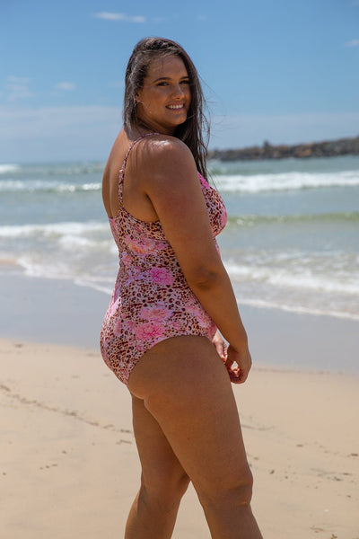 Brunette model wearing plus size leopard floral swimsuit australia