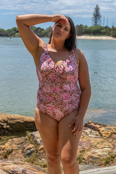 Brunette model wearing leopard floral frill one piece