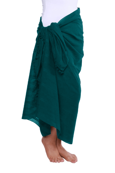 model wearing teal tie side sarong