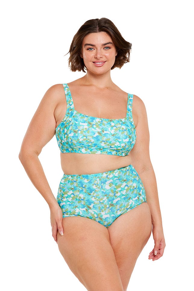 Brunette plus size model wears turquoise blue tummy control high waisted bikini bottom