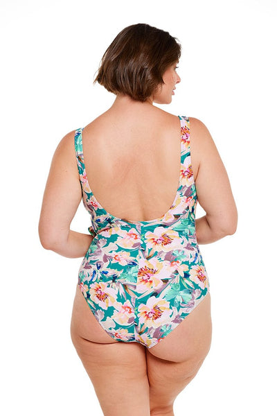 Brunette model wearing teal floral scoop low back one piece