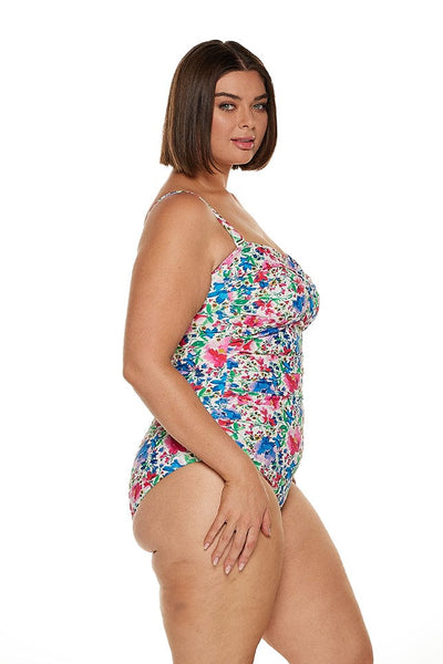 Brunette women wears multicoloured strapless bandeau one piece with removable straps