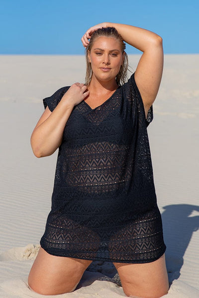 blonde size 18 plus size model wearing black mesh see-through beach cover up at the beach