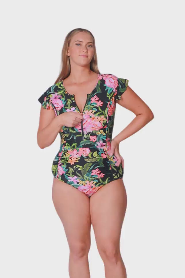 blonde plus size model wearing tropical floral frill sleeve zip front one piece