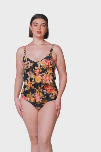Video of model wearing a colourful floral one piece for curve women