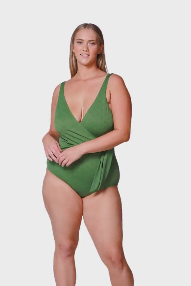blonde plus size women wearing olive green textured v neck one piece swimwear