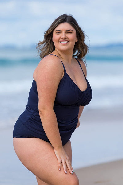 model wearing plus size underwire tankini top in navy