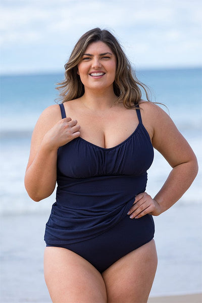 model wearing plus size navy honey comb textured tankini top with underwire