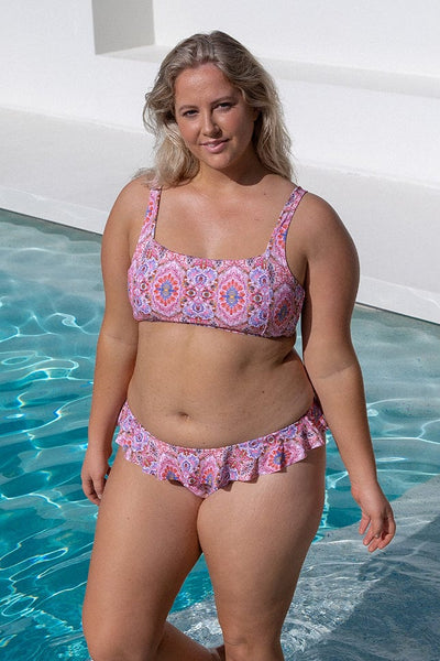 blonde plus size women wearing pink frill bikini pant with a square neckline bikini top 